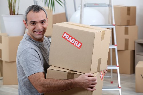 Worker following health and safety procedures during a move