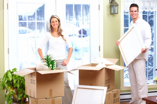 Careful packing of household items for a move in South London