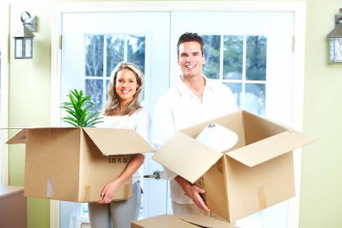 Urgent house move with boxes and furniture in a Crystal Palace street